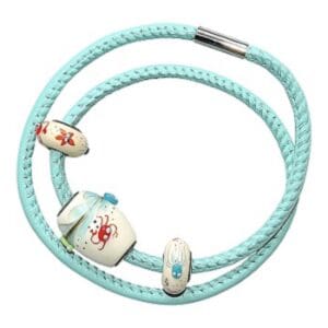 Turquoise bracelet with decorative ceramic beads.