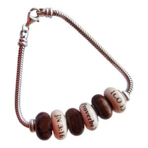 Bracelet with engraved beads and silver chain.