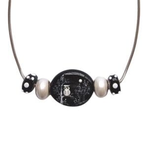 Owl-themed necklace with black and silver beads.