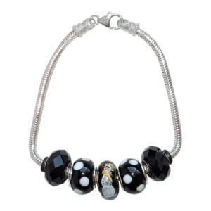Silver bracelet with black and white beads.