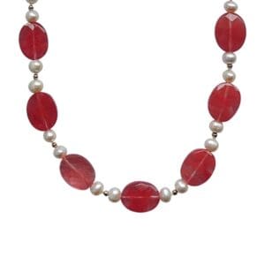 Red and pearl beaded necklace on display.