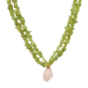 Green gemstone necklace with pink pendant.
