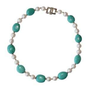 Turquoise and pearl necklace with silver clasp.