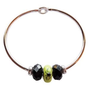 Bracelet with black beads and spider design.