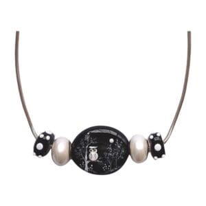 Owl pendant necklace with black and silver beads.