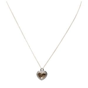 Silver necklace with heart-shaped pendant.