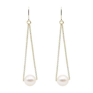 Gold chain earrings with white pearls.