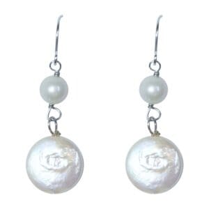 Silver hook earrings with white pearls.