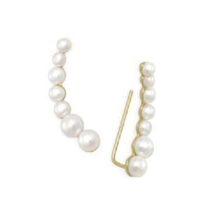 Gold earrings with white pearls.