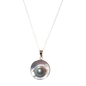 Silver necklace with round pearl pendant.