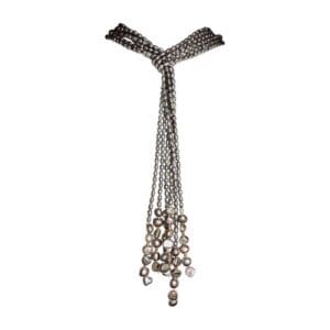 Long pearl necklace with multiple strands.