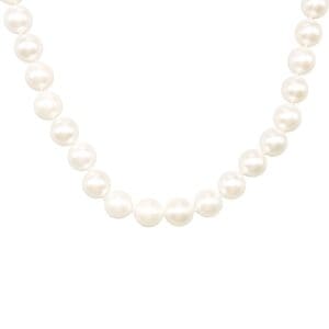 String of white pearls on white background.