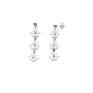 Silver earrings with pearl flower clusters.