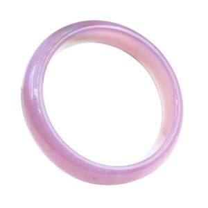 Pink jade bangle bracelet on white background.