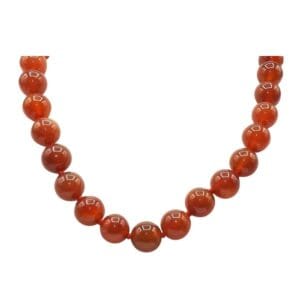 Red beaded necklace on white background.