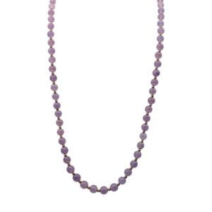 Purple beaded necklace on white background.