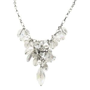 Silver chain necklace with crystal-like pendants.