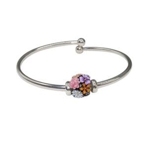Silver bracelet with colorful floral charm.