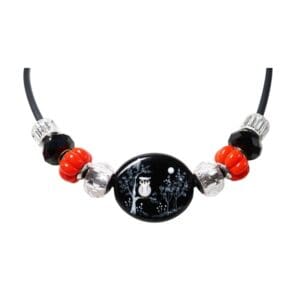 Owl-themed beaded necklace with black and red.