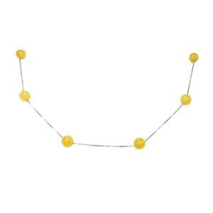 Yellow beads on a curved string.
