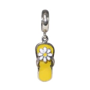 Yellow sandal charm with a flower design.