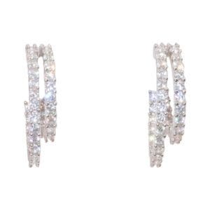 Silver diamond-studded hoop earrings pair.
