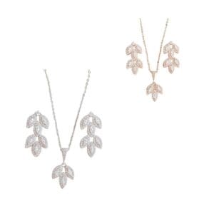 Silver and gold leaf jewelry sets displayed.