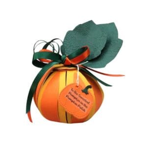 Orange gift box shaped like a pumpkin.