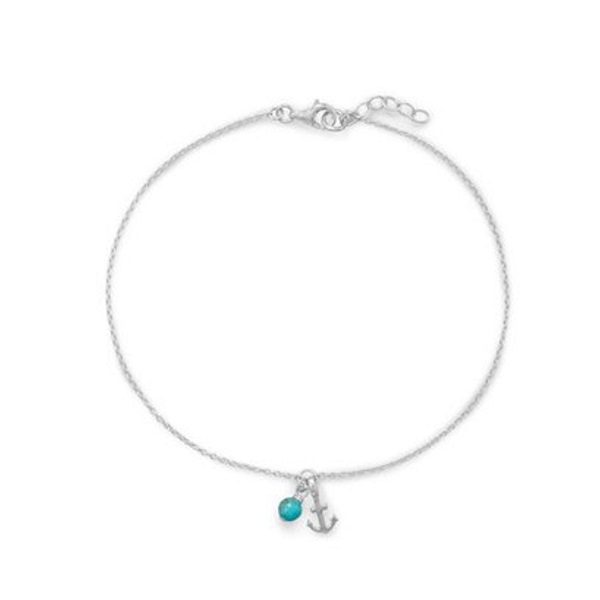 The Anchor with Turquoise Anklet is a silver chain adorned with an anchor charm and turquoise bead, featuring an adjustable clasp.