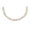 A necklace featuring interwoven strands of crystals and pearls. Product: 3 Strands of Crystal with 1 Strand of Pearl Twist Necklace.