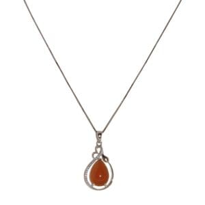 Coffee Jade Pendant: A silver necklace featuring a teardrop-shaped orange gemstone pendant, accented with small clear stones, set against a plain white background.
