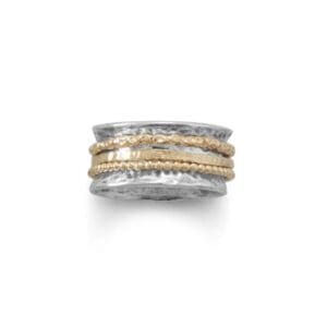Silver ring with gold textured bands.