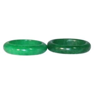 Two green jade bracelets on white background.
