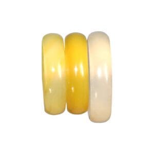 Three jade bangles in yellow hues.
