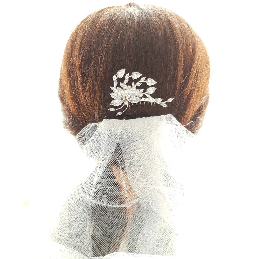 Bridal hairstyle with decorative hair accessory.