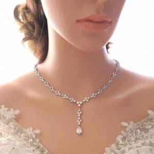 Woman wearing elegant diamond necklace.
