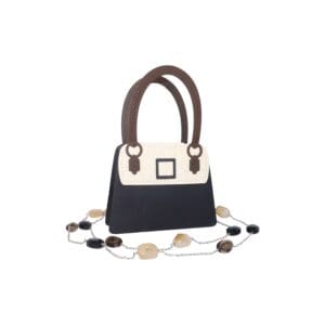 Black and white handbag with decorative chain.